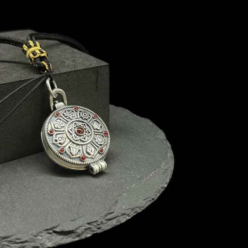 Original Design Eight Auspicious Symbols Kalu Box Pendant, paired with a hand-woven adjustable Perfect Peace necklace.
